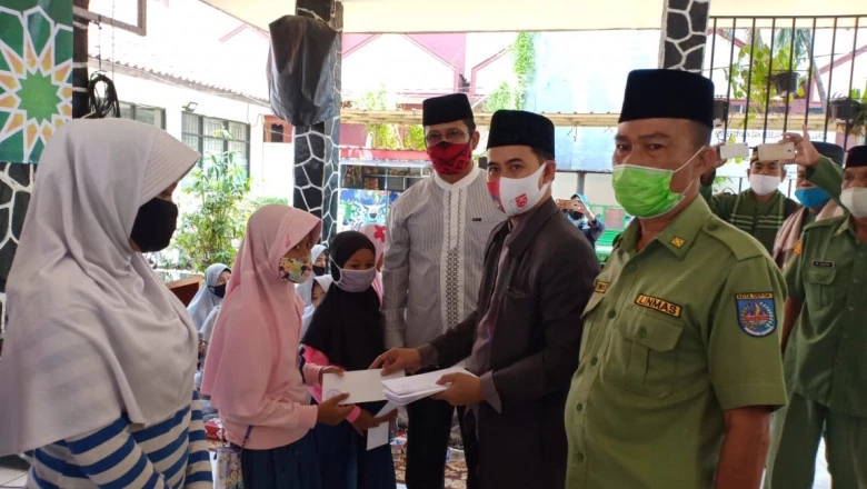 Satlinmas Panmas Santuni 60 Anak Yatim